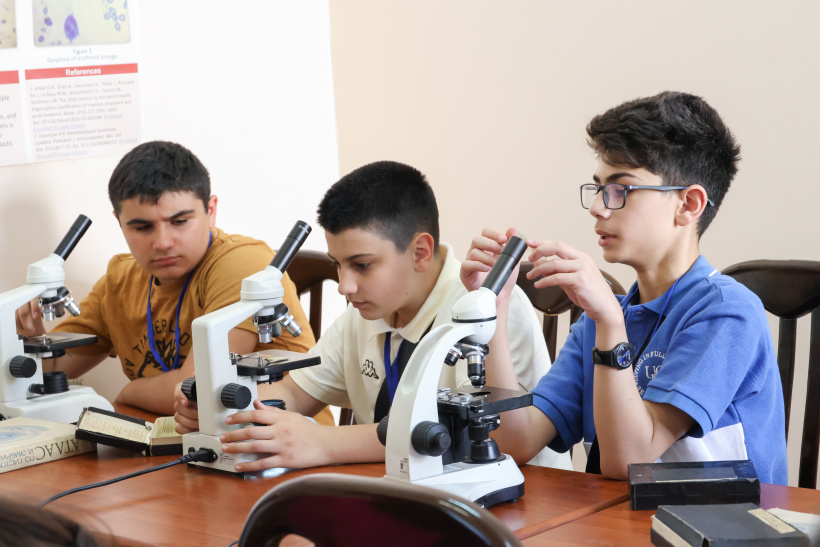 Students using microscopes